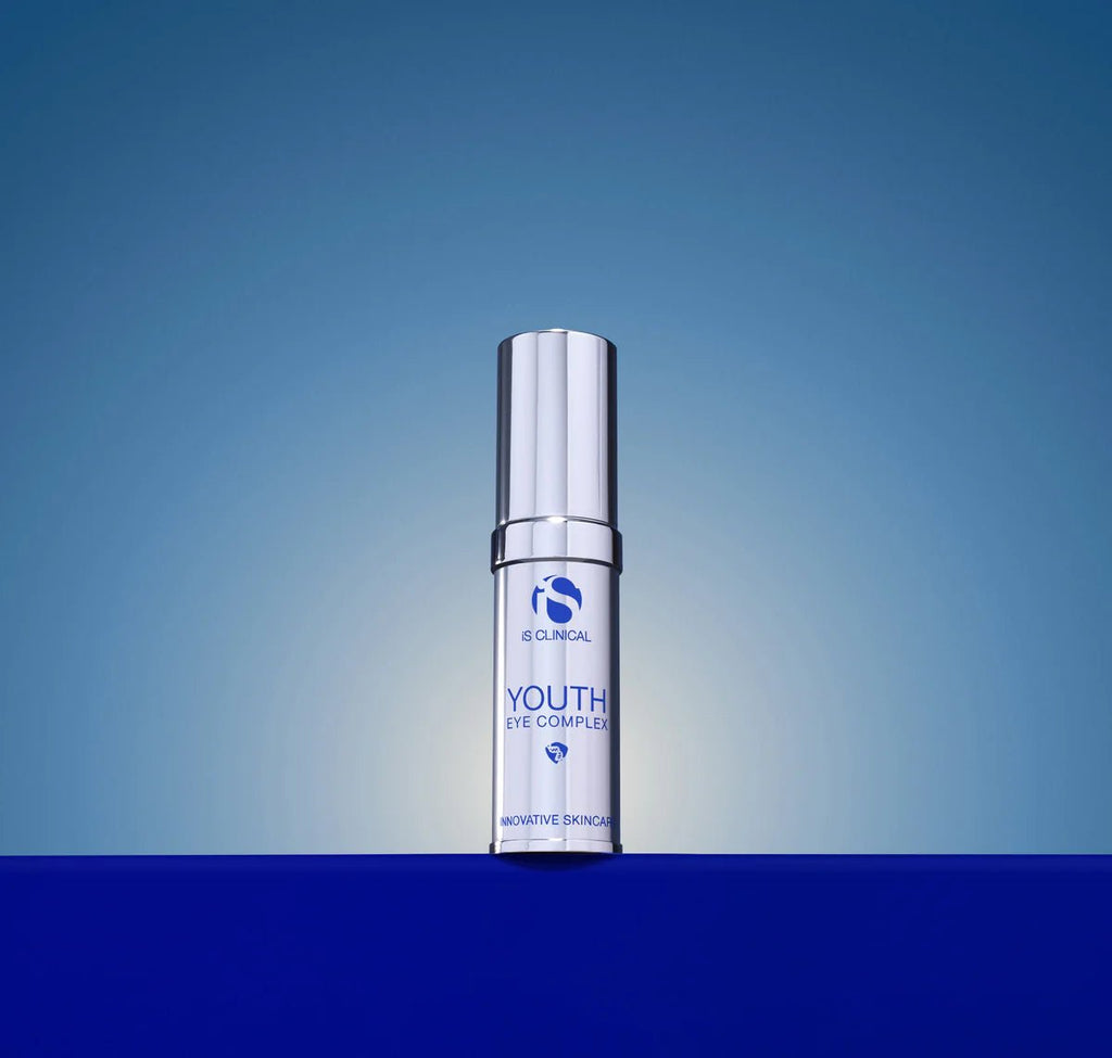 Skincare serum bottle labeled 'Youth' on a blue gradient background